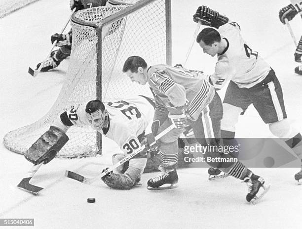 Penguins vs. L.A. Kings. Los Angeles goalie Terry Sawchuck deflects shot by Pittsburgh's Ken Schinkel helped by L.A. #2 Bob Wall in action at the...