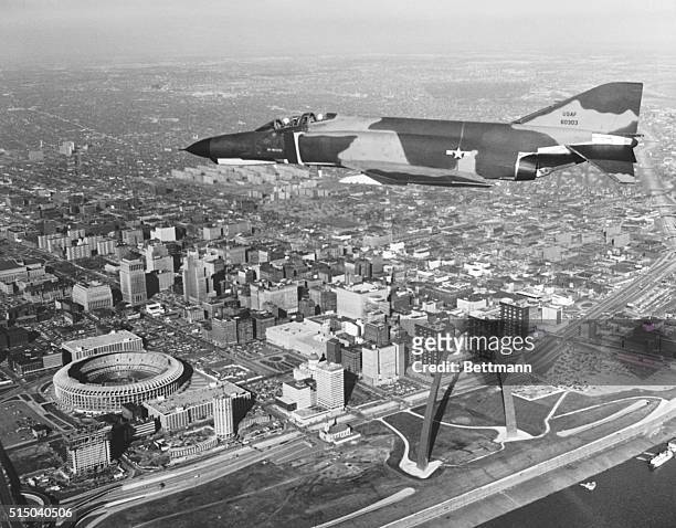 The Mcdonnell-Douglas F-4E Phantom, the fastest gun in the sky, draws a bead on the picturesque St. Louis waterfront - taking in its sites, the...