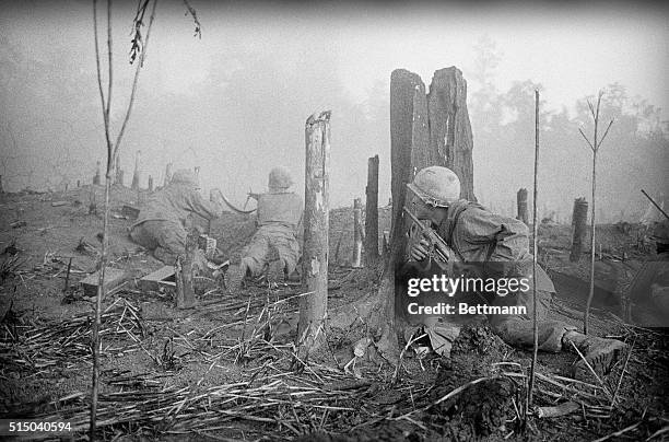 Members of the U.S. 1st Infantry Division take cover and return fire here. For two hours, first with mortar barrage and then in charges from all...