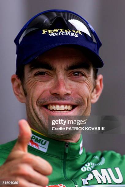 The new green jersey German Marcel Wust thumbs up on the podium of the 7th stage of the 87th Tour de France in Limoges, central France, 07 July 2000....