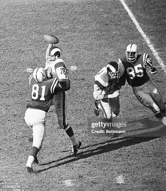 Although he had occasional problems with defensive rushing, Roman Gabriel of the Los Angeles Rams, gave Johnny Unitas of the Colts a lesson in...