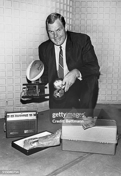 Rams linemen Merlin Olsen sits among some of the awards presented to him at the pre-Pro Bowl party honoring the best of the NFL superstars. The party...