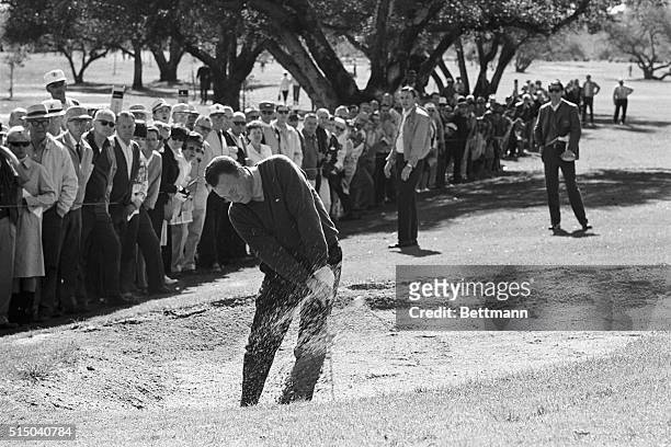 Billy Casper blasts out of a sand trap on the third green as he goes 9 under on the fourth round of the Los Angeles Open Golf Tournament 1/28. Casper...