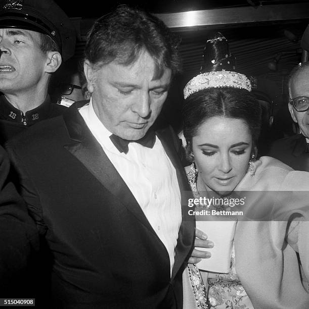 Actress Elizabeth Taylor and husband Richard Burton arrive in this photo at the Plaza Hotel in New York for meeting with the press. The couple is...
