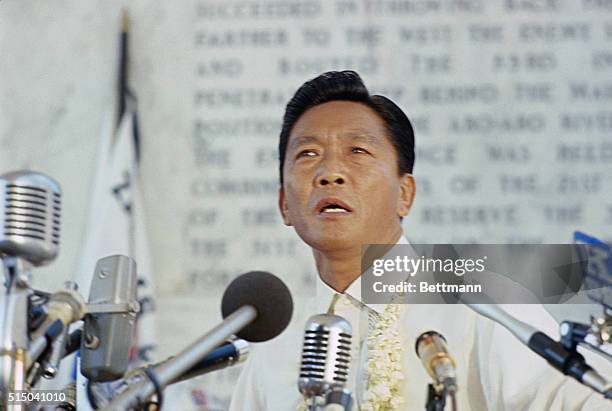 President Ferdinand E. Marcos speaks at dedication of a concrete cross, 92 meters high, which is a war memorial on the mountain top, whose fall...