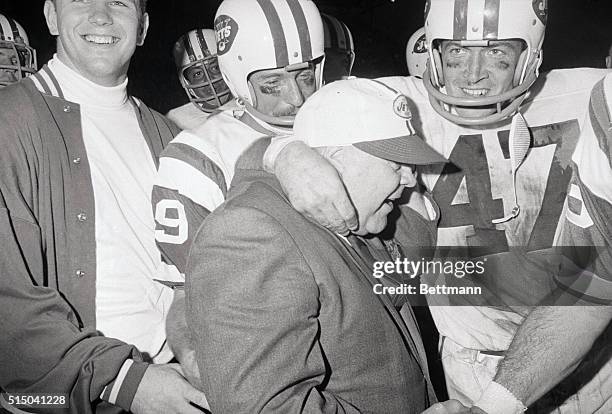 Miami: New York Jets coach Weeb Eubank is congratulated by defensive back Mike D'Amato and Bake Turner as they leave the field after upsetting the...