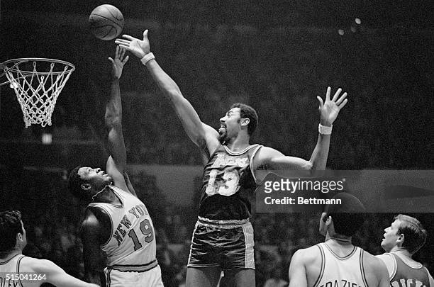 Fingertips New York: Wilt Chamberlain of the Los Angeles Lakers and Willis Reed of the New York Knickerbockers go after a rebound during game at...
