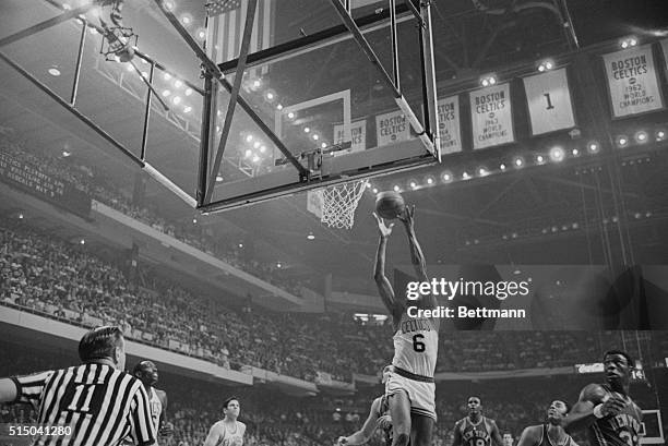 Knicks' Dave Bradley finds himself surrounded by Celtics players during 2nd quarter action of the 6th game of the Eastern NBA Playoff series here,...