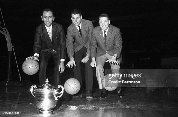 Coaches Bob Cousy of Boston College , Bobby Knight of Army and Ray Mears of Tennessee dribble towards the trophy each hopes to take back to his...