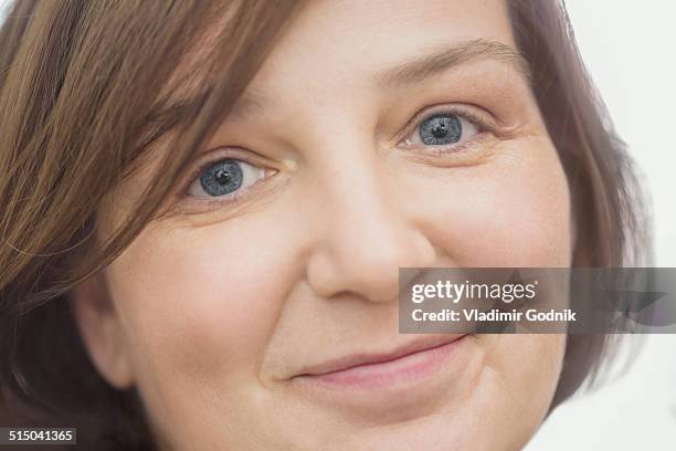 close-up portrait of happy mature woman over white background - russian mature women 個照片及圖片檔