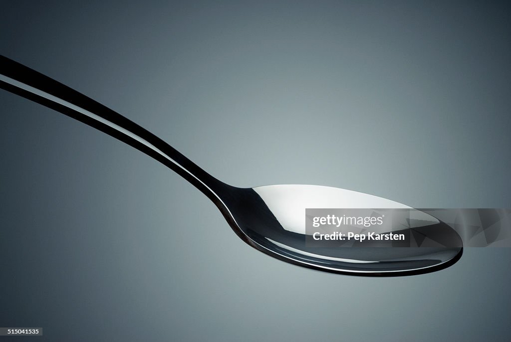 Close-up of a spoon in mid-air