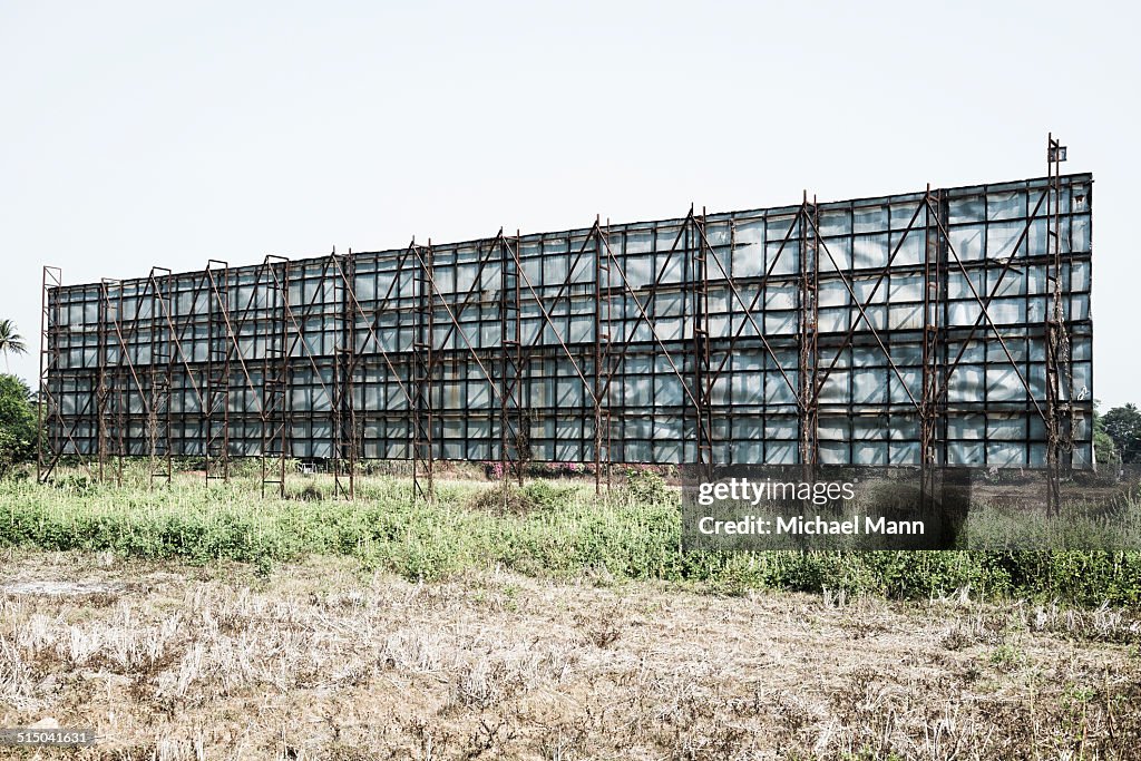 Large billboard on field against clear sky