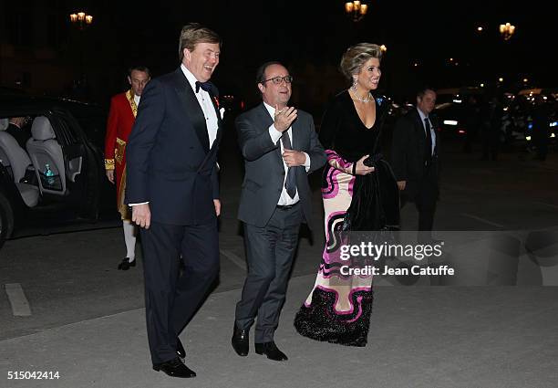 King Willem-Alexander of the Netherlands and Queen Maxima of the Netherlands welcome President of France Francois Hollande to a reception they're...