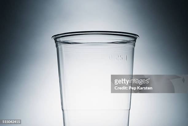 an empty clear plastic cup - disposable cup foto e immagini stock