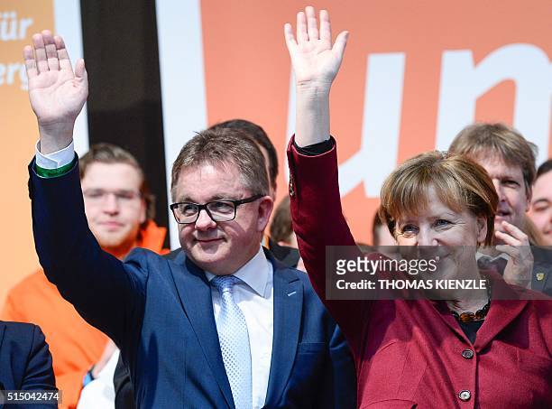 German Chancellor Angela Merkel and Guido Wolf , top candidate of the Christian Democratic Union for the state elections in German state...