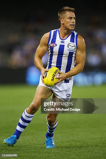 Andrew Swallow of the Kangaroos looks upfield during the NAB CHallenge AFL match between the Hawthorn Hawks and the North Melbourne Kangaroos at...