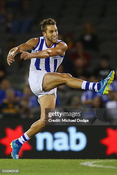 Jamie Macmillan of the Kangaroos kicks the ball during the NAB CHallenge AFL match between the Hawthorn Hawks and the North Melbourne Kangaroos at...