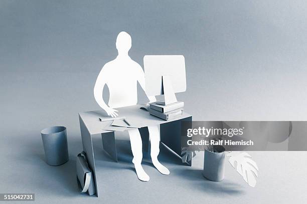 paper businessman working at desk over gray background - paper craft stock pictures, royalty-free photos & images