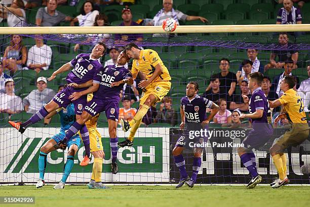 Shane Lowry and Richard Garcia of the Glory contest a header from a corner kick against Harry Ashcroft of the Mariners during the round 23 A-League...