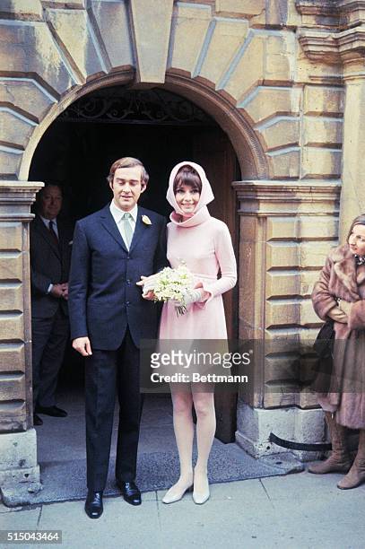 Film star Audrey Hepburn poses with her new husband, Italian psychiatrist Dr. Andrea Dotti, after their wedding, January 18th.