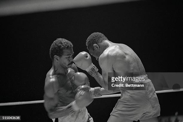 Mexico City's Jose Napoles moves in close to send a series of punches to the head of Walter weight Champion Curtis Cokes at the Forum. Napoles won...