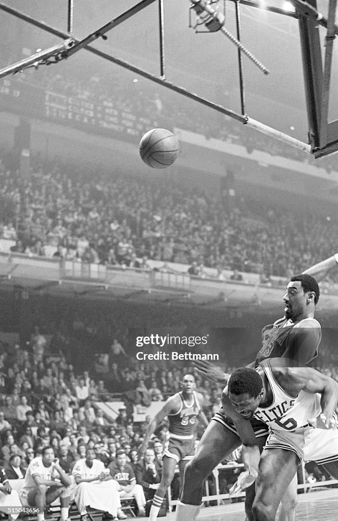 Wilt Chamberlain Landing on Bill Russell's Back