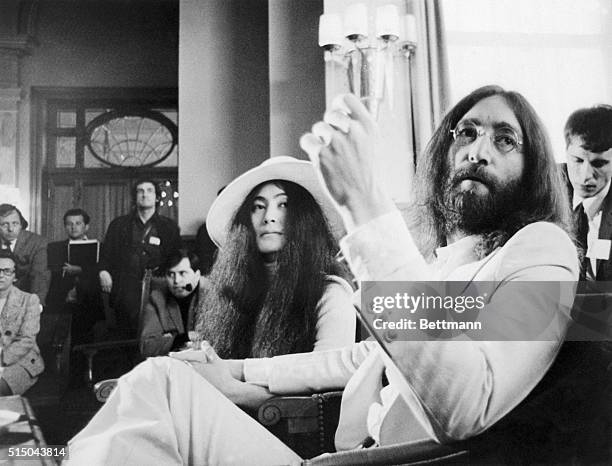 Beatle John Lennon and his wife, Yoko, hold press conference at the Palace Hotel here April 27th. They are here to attend a screening of "The Rape",...