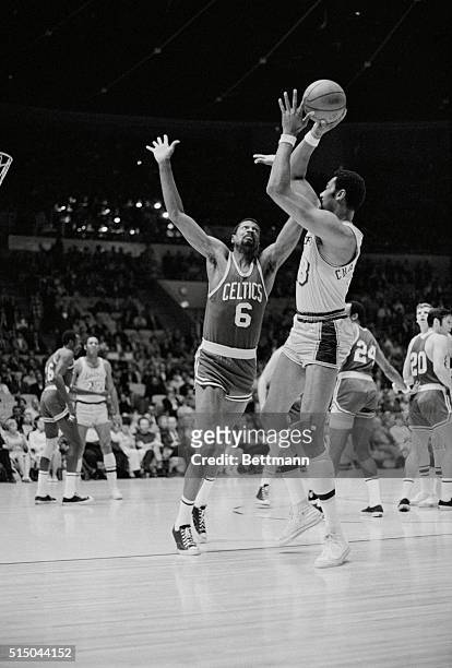 Boston Celtics player-coach Bill Russell attempts to block shot by Los Angeles Lakers center Wilt Chamberlain during first quarter of game at the...