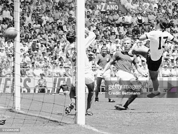 Leon, Mexico: German world cup top scorer Gerd Mueller scores 3rd and winning goal against England past goalie Peter Bonetti and Bobby Moore during...