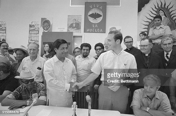 American labor leader and civil rights activist, Cesar Chavez , left) shaking hands with John Giumarra jr. Of Giumarra Vineyards Corp., one of 28...