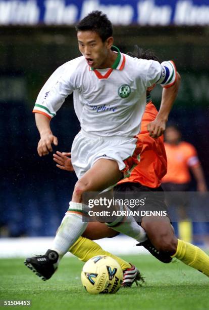 India's Baichung Bhutia dribbles during the match against Bangladesh at Filbert Street in Leicester 29 July 2000. Bhutia plays in the English...