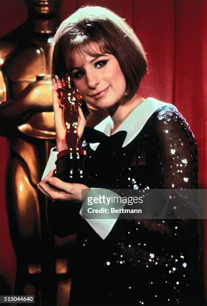 Barbara Streisand holds the Oscar she won for Funny Girl.