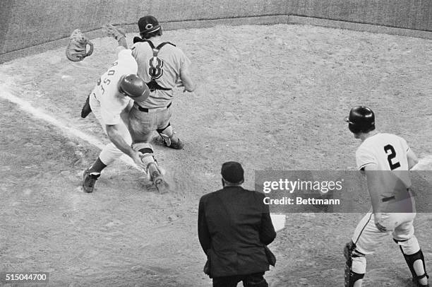 Pete Rose of the Cincinnati Reds collides into Cleveland Indians' catcher Ray Fosse and scores the winning run from second base on Chicago Cubs' Jim...