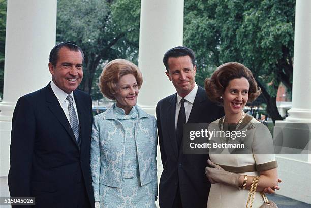 President Nixon and Mrs. Nixon flank Belgium's King Baudouin and Queen Fabiola inside the White house here May 20. The visiting royalty were...