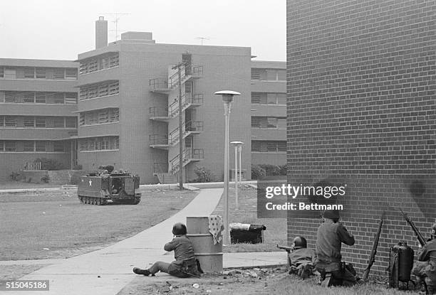 Greensboro, North Carolina: Three National Guardsmen take a sight on Scott Dorm at North Carolina A and T University as they return sniper fire from...