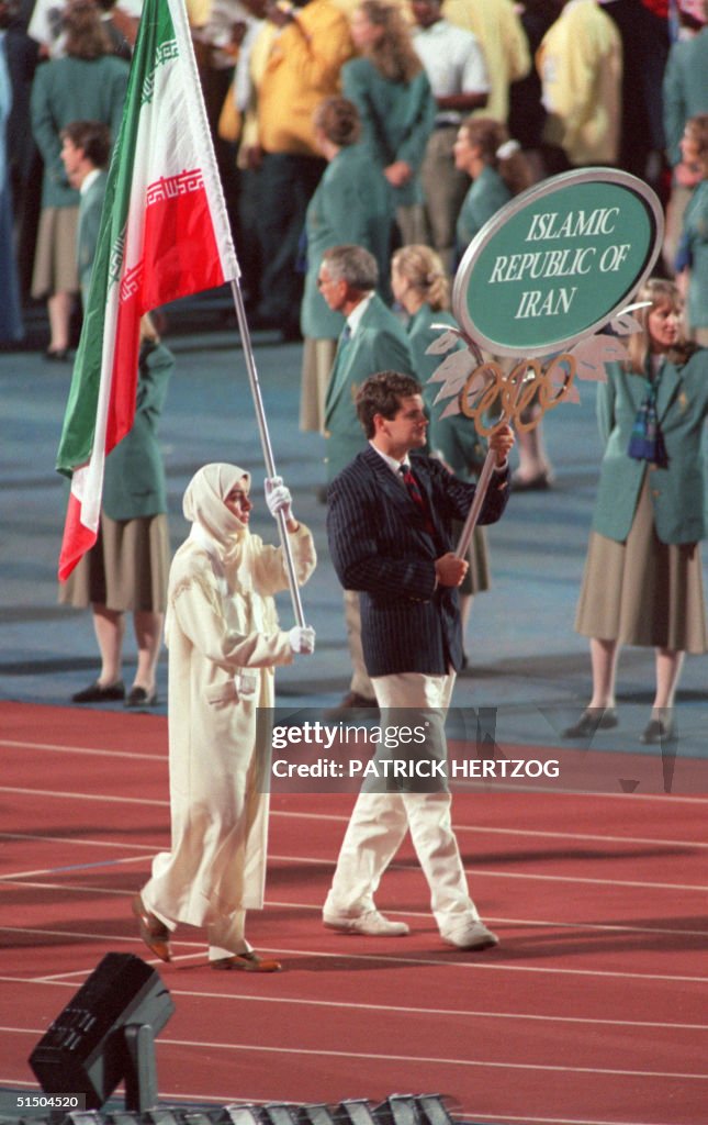 Iranian shooter Lida Fariman carries her delegatio