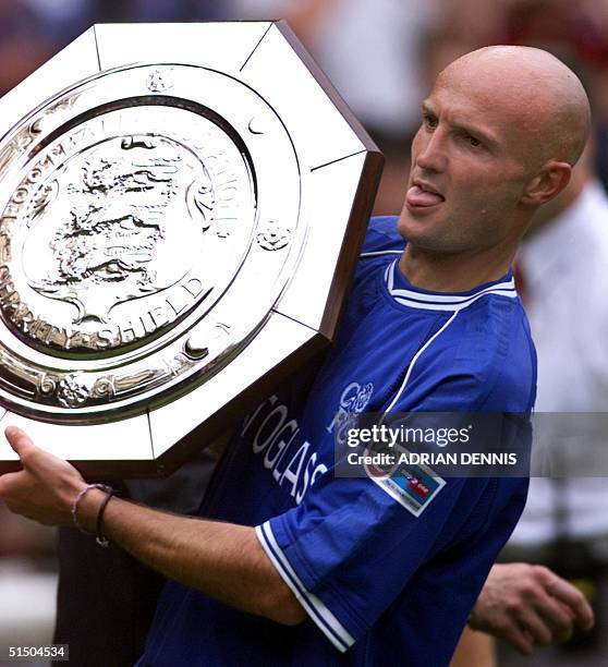 Chelsea's Frenchman Franck Leboeuf struggles to hold the F.A Charity Shield at Wembley stadium in London 13 August 2000. Chelsea beat Manchester...