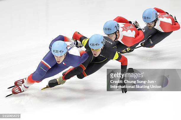 Sebastien Lepape of France, Jens Almey of Belgium, Charles Hamelin and Samuel Girard of Canada compete in the Men 1500m Semifinals during the ISU...