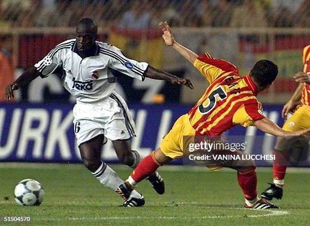 Real Madrid's player Claude Makelele fights for the ball with Galatasaray's player Belozoglu Emre 25 August 2000 at the Louis II stadium in Monaco,...