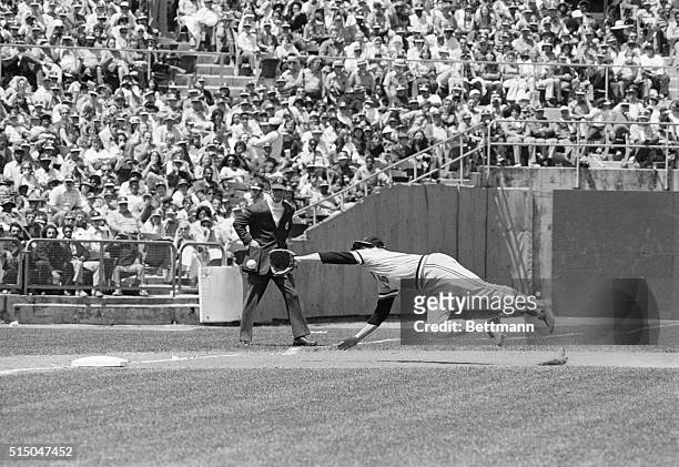Oakland: Baltimore's 3rd baseman Brooke Robinson, diving to his right, makes a sensational catch of Gene Teance's sharp grounder down the base line...