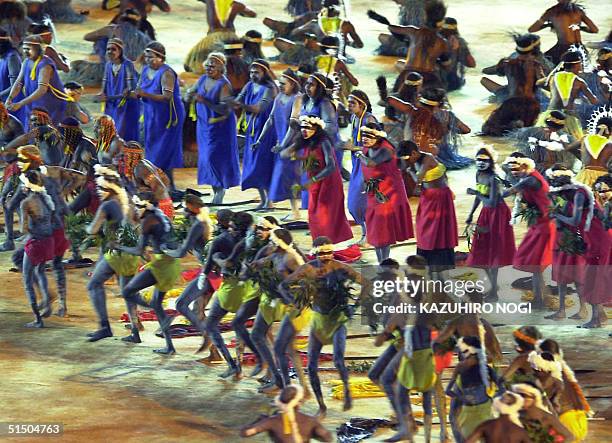 Performs enact an aboriginal dance during the "Djakapurra and clans and Wandjina" segment 15 September 2000 during the opening ceremony of the Sydney...