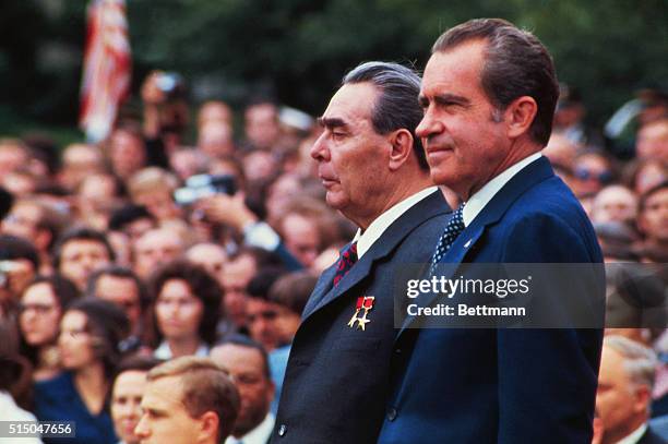 Washington, DC. President Richard Nixon and visiting Soviet leader Leonid Brezhnev appear on platform during the official welcoming ceremonies on the...