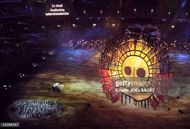 Sun lights up the grounds of the Olympic Stadium during the "Djakapurra & clans & Wandjina" segment of the opening ceremony of the 2000 Summer...