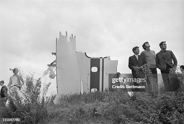 Piece of the wing of the Soviet supersonic Tupolev 144 Jet, bearing the letters "CCCP," lie at the edge of a field in suburban Goussainville, after...