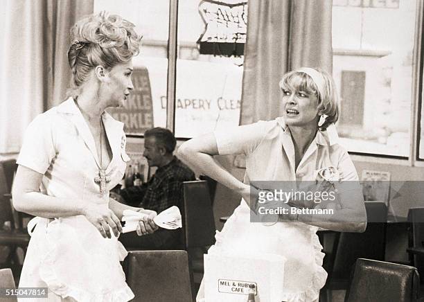 Actress Diane Ladd and Ellen Burstyn in a scene from the movie Alice Doesn't Live Here Anymore. Burstyn is shown trying to open a jar as Ladd sets a...