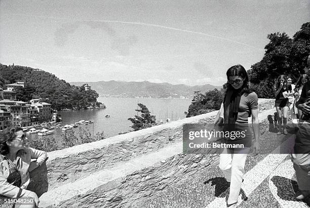 Mrs. Jacqueline Onassis is accompanied by her daughter, Caroline , during sightseeing stroll in this Italian Riviera resort have June 14th. Mrs....