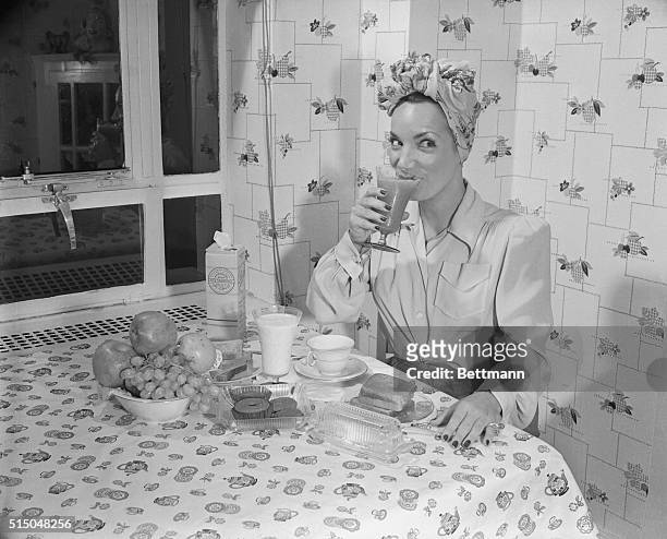 Carmen Miranda Begins Her Day With Breakfast, circa 1940.