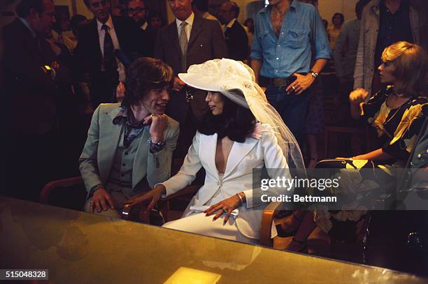 British rock star Mick Jagger, the 28 year old leader of the Rolling Stones, and his bride, Nicaraguan Bianca Pérez-Mora Macías, on the steps of Town...