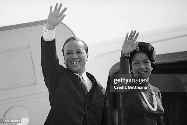 South Vietnam President Nguyen Van Thieu and his wife wave as they prepare to board plane at nearby Andrews AFB, Maryland, 4/7, for Austin, Texas,...