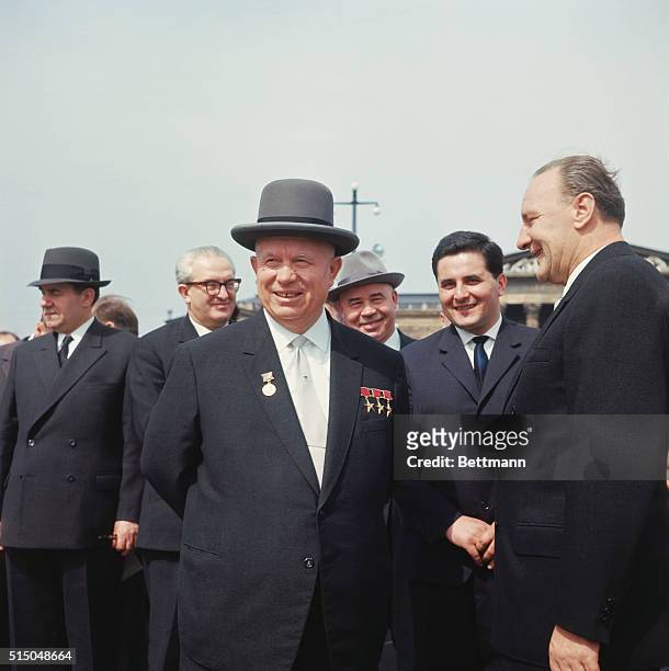 Khrushchev and Kadar enjoying summery weather after wreath laying ceremony. In back from left Andrei Grmyko, Andropov , Shelest , interpreter.